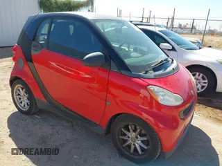 2009 Smart fortwo Pure with VIN WMEEJ31X59K291372, listed as a IAAI auction lot 41826469 with 87,773 mi miles. Bid and sale history available at carsss.com. Image 1.