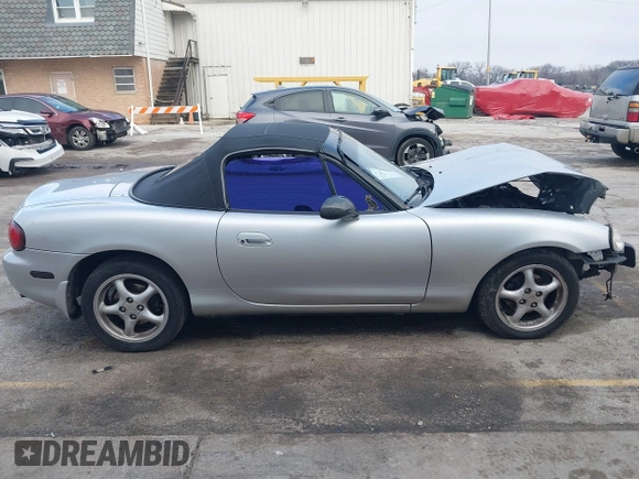 2002 Mazda MX-5 Miata Cloth z VIN JM1NB353320230803, wystawiony jako IAAI lot #41209388 z przebiegiem 84 815 mil mil oraz . Historia ofert i sprzedaży dostępna na DreamBid. Obrazek 13.