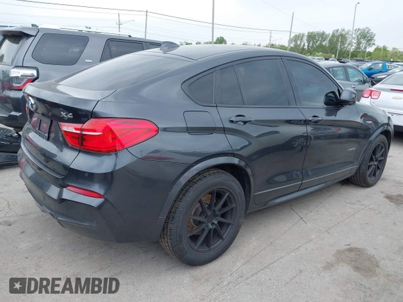 2015 BMW X4 xDrive28i with VIN 5UXXW3C54F0M88740, listed as a IAAI auction lot 42275157 with 159,281 mi miles and . Bid and sale history available at DreamBid. Image 4.