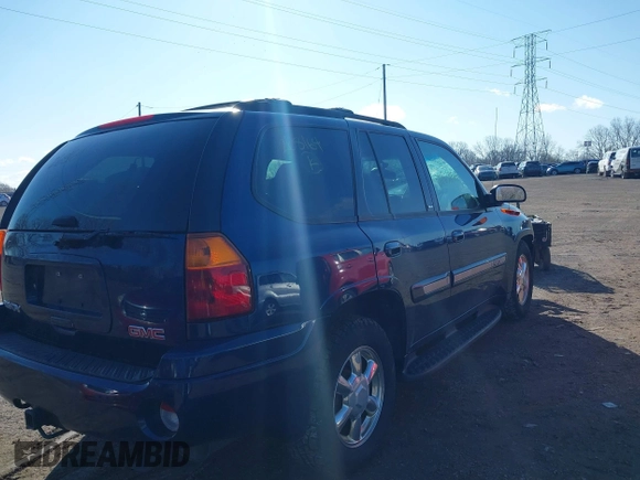 2003 GMC Envoy SLT with VIN 1GKDT13S732268164, listed as a IAAI auction lot 41863800 with 100,702 mi miles. Bid and sale history available at carsss.com. Image 4.