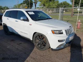 2015 Jeep Grand Cherokee Summit with VIN 1C4RJFJT5FC767687, listed as a IAAI auction lot 42015878 with 1 mi miles. Bid and sale history available at carsss.com. Image 1.