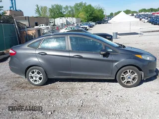 2015 Ford Fiesta SE z VIN 3FADP4BJ7FM158471, wystawiony jako IAAI lot #42090819 z przebiegiem 139 779 mil mil oraz . Historia ofert i sprzedaży dostępna na DreamBid. Obrazek 13.
