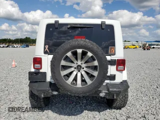 2016 Jeep Wrangler Unlimited Rubicon with VIN 1C4BJWFG9GL103312, listed as a Copart auction lot 52559465 with 79,692 mi miles and Salvage Title. Bid and sale history available at carsss.com. Image 6.