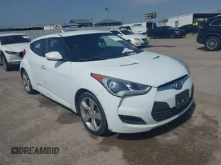 2014 Hyundai Veloster RE:FLEX z VIN KMHTC6AD5EU201168, wystawiony jako IAAI lot #41930766 z przebiegiem 198 909 mil mil oraz . Historia ofert i sprzedaży dostępna na DreamBid. Obrazek 1.