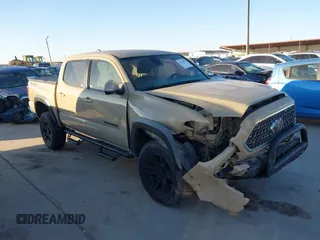 2019 Toyota Tacoma SR z VIN 3TMCZ5AN9KM214768, wystawiony jako IAAI lot #41766955 z przebiegiem 188 314 mil mil oraz . Historia ofert i sprzedaży dostępna na DreamBid. Obrazek 1.