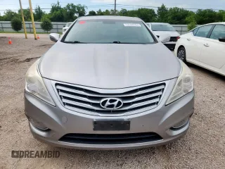 2013 Hyundai Azera z VIN KMHFG4JG9DA217664, wystawiony jako Copart lot #60855945 z przebiegiem 115 623 mil mil oraz Czysty tytuł • Clean title. Historia ofert i sprzedaży dostępna na DreamBid. Obrazek 5.