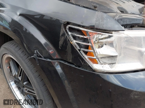 2014 Dodge Journey SXT with VIN 3C4PDCBG1ET127798, listed as a IAAI auction lot 41799898 with 178,873 mi miles and . Bid and sale history available at DreamBid. Image 6.
