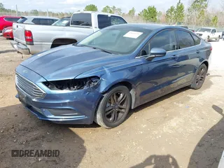 2018 Ford Fusion SE z VIN 3FA6P0H79JR195109, wystawiony jako IAAI lot #41664930 z przebiegiem 105 374 mil mil oraz . Historia ofert i sprzedaży dostępna na DreamBid. Obrazek 2.