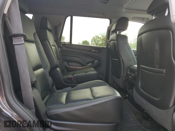 2015 Chevrolet Tahoe LTZ with VIN 1GNSKCKC9FR698924, listed as a Copart auction lot 56196895 with 184,740 mi miles and Salvage title. Bid and sale history available at DreamBid. Image 11.