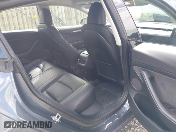 2023 Tesla Model 3 with VIN 5YJ3E1EA4PF515844, listed as a IAAI auction lot 42321123 with 46,683 mi miles and . Bid and sale history available at DreamBid. Image 8.