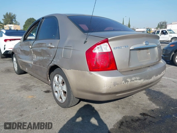 2004 Kia Spectra LX with VIN KNAFE122145013930, listed as a IAAI auction lot 41627031 with 93,565 mi miles. Bid and sale history available at carsss.com. Image 3.