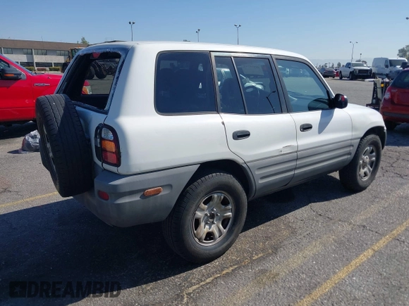 1999 Toyota RAV4 with VIN JT3GP10V2X7064915, listed as a IAAI auction lot 41998544 with 302,351 mi miles and . Bid and sale history available at DreamBid. Image 4.