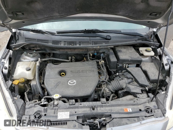 2015 Mazda 5 Sport z VIN JM1CW2BL2F0179147, wystawiony jako Copart lot #54125515 z przebiegiem 94 294 mil mil oraz Szkoda całkowita • Salvage title. Historia ofert i sprzedaży dostępna na DreamBid. Obrazek 12.