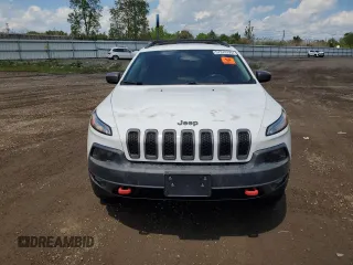 2014 Jeep Cherokee Trailhawk z VIN 1C4PJMBS5EW201897, wystawiony jako Copart lot #57378795 z przebiegiem 172 715 mil mil oraz Szkody całkowita. Historia ofert i sprzedaży dostępna na DreamBid. Obrazek 5.