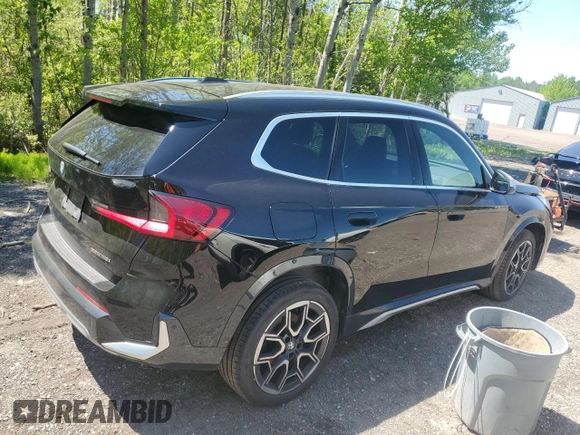 2023 BMW X1 xDrive28i with VIN WBX73EF04P5X86962, listed as a Copart auction lot 57575815 with 95,965 mi miles and Salvage title. Bid and sale history available at DreamBid. Image 3.