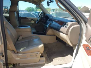 2012 Chevrolet Suburban LT with VIN 1GNSCJE03CR128206, listed as a IAAI auction lot 42002119 with 329,078 mi miles. Bid and sale history available at carsss.com. Image 5.
