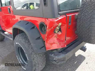 2002 Jeep Wrangler X with VIN 1J4FA39S02P739211, listed as a IAAI auction lot 41665910 with 144,118 mi miles. Bid and sale history available at carsss.com. Image 6.