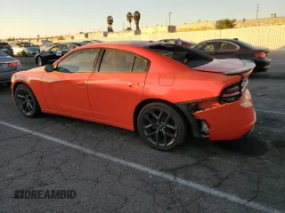 2021 Dodge Charger SXT with VIN 2C3CDXBG5MH533942, listed as a Copart auction lot 85306964 with 64,682 mi miles and Salvage Title. Bid and sale history available at carsss.com. Image 2.