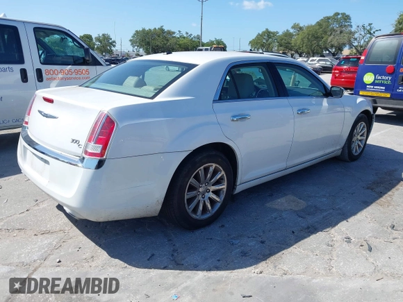 2014 Chrysler 300 with VIN 2C3CCAET6EH173381, listed as a IAAI auction lot 42158270 with 124,551 mi miles. Bid and sale history available at carsss.com. Image 4.