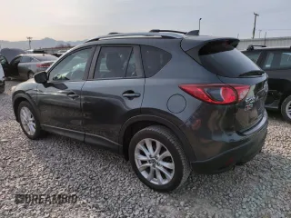 2015 Mazda CX-5 Grand Touring with VIN JM3KE4DY3F0495411, listed as a Copart auction lot 50077765 with 136,191 mi miles and Salvage Title. Bid and sale history available at DreamBid. Image 2.