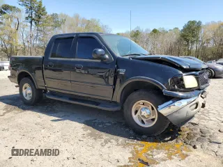 2003 Ford F-150 XLT with VIN 1FTRW08L63KB47470, listed as a Copart auction lot 50400055 with 223,859 mi miles and Salvage Title. Bid and sale history available at carsss.com. Image 4.