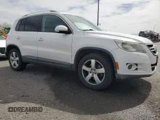 2010 Volkswagen Tiguan Wolfsburg Edition with VIN WVGAV7AX7AW003188, listed as a Copart auction lot 56692535 with 121,502 mi miles and Salvage title. Bid and sale history available at DreamBid. Image 4.
