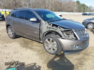 2012 Cadillac SRX Performance Collection with VIN 3GYFNBE3XCS565616, listed as a IAAI auction lot 41835476 with 141,259 mi miles. Bid and sale history available at carsss.com. Image 1.