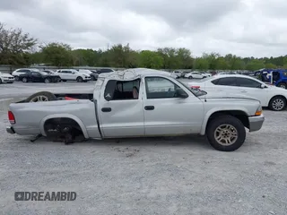 2003 Dodge Dakota SLT with VIN 1D7HL48N13S274856, listed as a IAAI auction lot 41954038 with 306,728 mi miles. Bid and sale history available at carsss.com. Image 13.