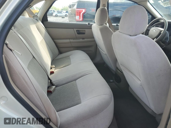 2005 Ford Taurus SE with VIN 1FAFP53U95A101336, listed as a Copart auction lot 56457095 with 127,656 mi miles and Salvage title. Bid and sale history available at DreamBid. Image 10.