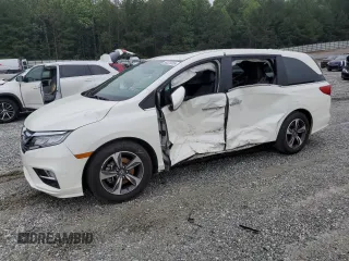 2018 Honda Odyssey Touring with VIN 5FNRL6H80JB094606, listed as a Copart auction lot 58223365 with 125,173 mi miles and Salvage title. Bid and sale history available at DreamBid. Image 1.