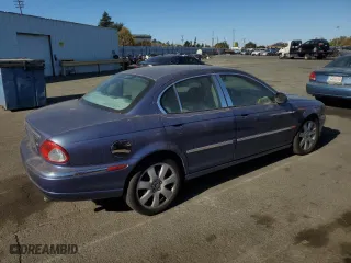 2004 Jaguar X-Type with VIN SAJEA51C04WD74995, listed as a Copart auction lot 77216404 with 87,853 mi miles and Clean Title. Bid and sale history available at carsss.com. Image 3.