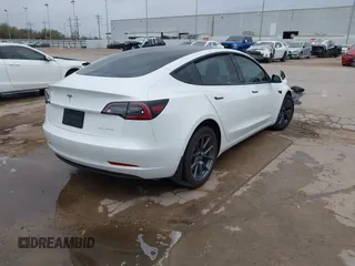 2021 Tesla Model 3 Long Range with VIN 5YJ3E1EB3MF059713, listed as a IAAI auction lot 41778289 with 52,211 mi miles. Bid and sale history available at carsss.com. Image 4.
