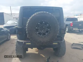 2014 Jeep Wrangler Unlimited Rubicon X with VIN 1C4HJWFG3EL274905, listed as a IAAI auction lot 41512631 with 123,961 mi miles and . Bid and sale history available at DreamBid. Image 17.