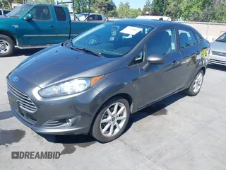 2019 Ford Fiesta SE z VIN 3FADP4BJ2KM131012, wystawiony jako IAAI lot #42228822 z przebiegiem 100 460 mil mil oraz . Historia ofert i sprzedaży dostępna na DreamBid. Obrazek 2.