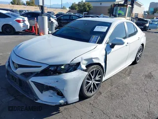 2023 Toyota Camry SE with VIN 4T1T11AK5PU117331, listed as a IAAI auction lot 41728043 with 13,019 mi miles and . Bid and sale history available at DreamBid. Image 2.