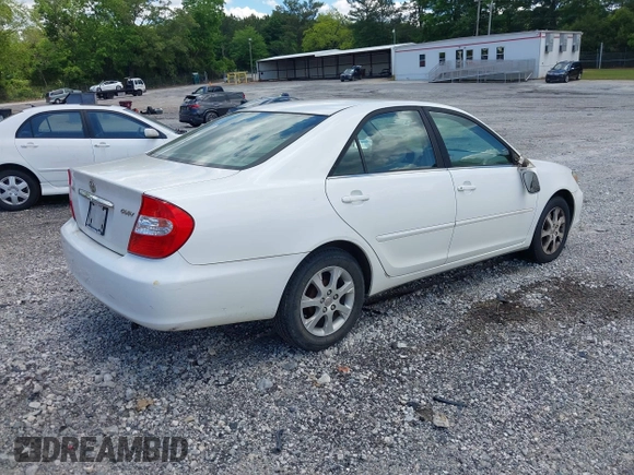 2004 Toyota Camry LE with VIN JTDBE32KX40279599, listed as a IAAI auction lot 42202160 with 288,879 mi miles and . Bid and sale history available at carsss.com. Image 4.
