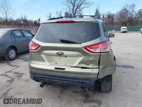 2013 Ford Escape SE with VIN 1FMCU9GX1DUB69236, listed as a IAAI auction lot 41575494 with 122,075 mi miles and . Bid and sale history available at DreamBid. Image 16.