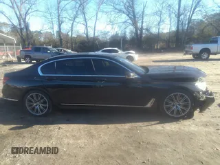 2018 BMW 7 Series 740i with VIN WBA7E2C57JG742257, listed as a IAAI auction lot 41353435 with 77,125 mi miles. Bid and sale history available at carsss.com. Image 14.