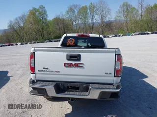 2019 GMC Canyon 4WD SLE z VIN 1GTG6CEN0K1353094, wystawiony jako IAAI lot #42065160 z przebiegiem 73 235 mil mil oraz . Historia ofert i sprzedaży dostępna na DreamBid. Obrazek 16.