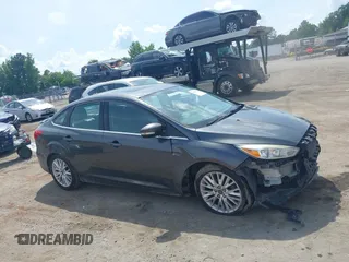 2017 Ford Focus Titanium with VIN 1FADP3J27HL306546, listed as a IAAI auction lot 42480576 with 114,285 mi miles and . Bid and sale history available at DreamBid. Image 14.