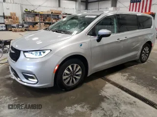 2023 Chrysler Pacifica Hybrid Touring L z VIN 2C4RC1L79PR604241, wystawiony jako Copart lot #58355805 z przebiegiem 65 909 mil mil oraz Tytuł czysty. Historia ofert i sprzedaży dostępna na DreamBid. Obrazek 1.