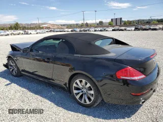 2009 BMW 6 Series 650i with VIN WBAEB53569C224337, listed as a Copart auction lot 68148974 with 75,057 mi miles and Salvage Title. Bid and sale history available at carsss.com. Image 2.