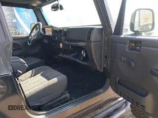 2004 Jeep Wrangler Rubicon with VIN 1J4FA69S64P789308, listed as a IAAI auction lot 41714489 with 186,302 mi miles. Bid and sale history available at carsss.com. Image 5.