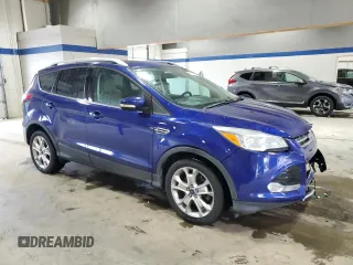 2014 Ford Escape Titanium with VIN 1FMCU9JX8EUC41088, listed as a Copart auction lot 52568435 with 114,907 mi miles and Salvage Title. Bid and sale history available at DreamBid. Image 4.