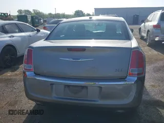 2014 Chrysler 300 with VIN 2C3CCAAG4EH159911, listed as a IAAI auction lot 41963042 with 105,972 mi miles and . Bid and sale history available at DreamBid. Image 16.
