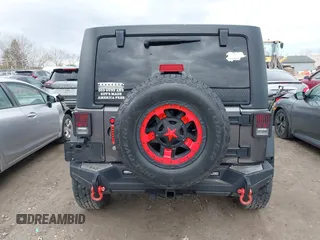 2014 Jeep Wrangler Unlimited Sport with VIN 1C4BJWDG6EL239378, listed as a IAAI auction lot 42073392 with 120,999 mi miles. Bid and sale history available at carsss.com. Image 17.