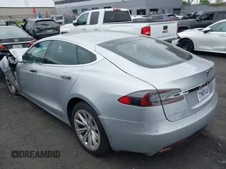 2017 Tesla Model S 100D with VIN 5YJSA1E24HF193563, listed as a IAAI auction lot 42120120 with 60,391 mi miles and . Bid and sale history available at DreamBid. Image 3.