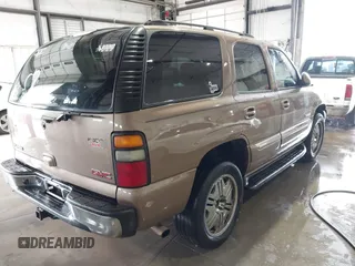 2004 GMC Yukon SLT with VIN 1GKEK13Z84R265500, listed as a IAAI auction lot 41412544 with 259,575 mi miles. Bid and sale history available at carsss.com. Image 4.