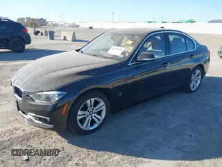 2017 BMW 3 Series 330e iPerformance with VIN WBA8E1C34HA156688, listed as a IAAI auction lot 41753490 with 74,130 mi miles. Bid and sale history available at carsss.com. Image 2.