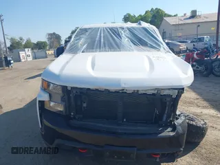 2021 Chevrolet Silverado 1500 Custom Trail Boss with VIN 3GCPYCEF1MG439764, listed as a IAAI auction lot 41868327 with 30,981 mi miles and . Bid and sale history available at DreamBid. Image 12.